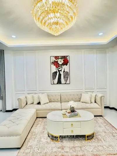 Luxurious living room with elegant chandelier and plush sectional sofa