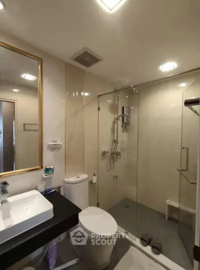 Modern bathroom with glass shower and elegant fixtures