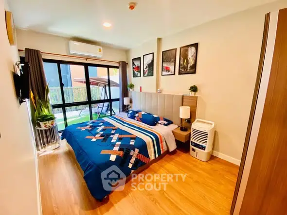 Modern bedroom with stylish decor and large window view