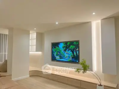 Modern living room with built-in TV and stylish lighting