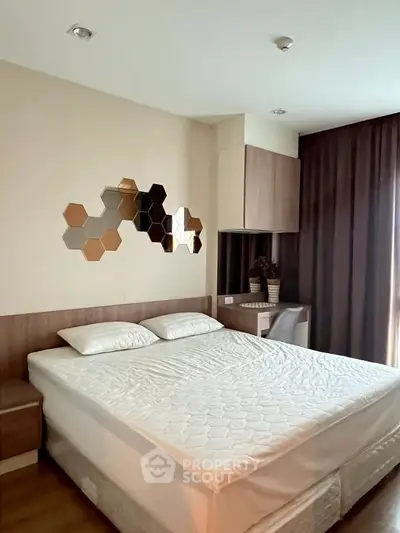 Modern bedroom with stylish hexagonal wall decor and cozy ambiance