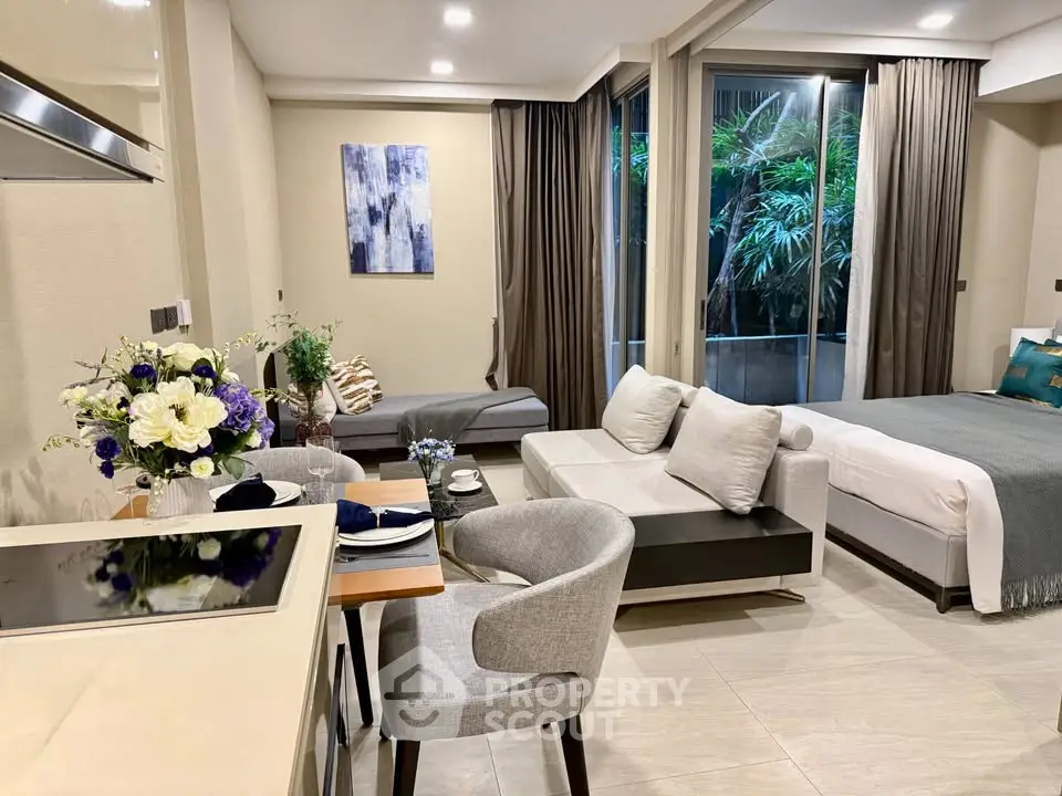 Modern open-plan living room with elegant decor and lush garden view