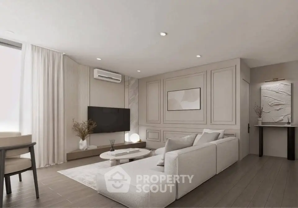 Elegant modern living room with stylish decor and neutral tones, featuring a cozy sectional sofa and wall-mounted TV.