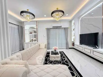 Luxurious living room with elegant chandeliers and plush seating in modern home