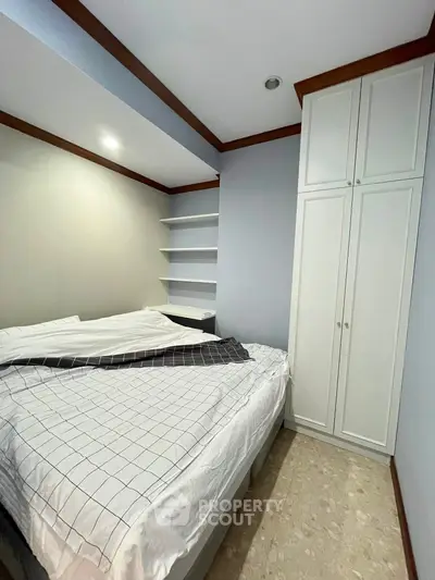 Cozy bedroom with built-in wardrobe and modern design
