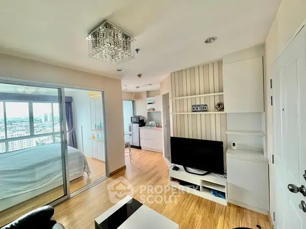 Modern apartment with open living area and city view, featuring sleek design and ample natural light.