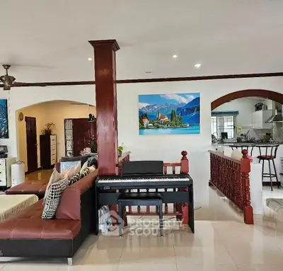 Spacious living room with modern decor and open kitchen layout