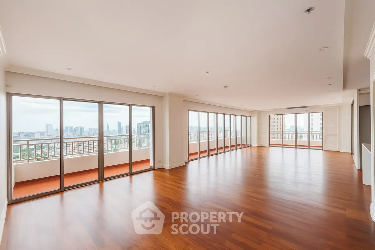 Spacious corner unit with panoramic city views and expansive balcony.