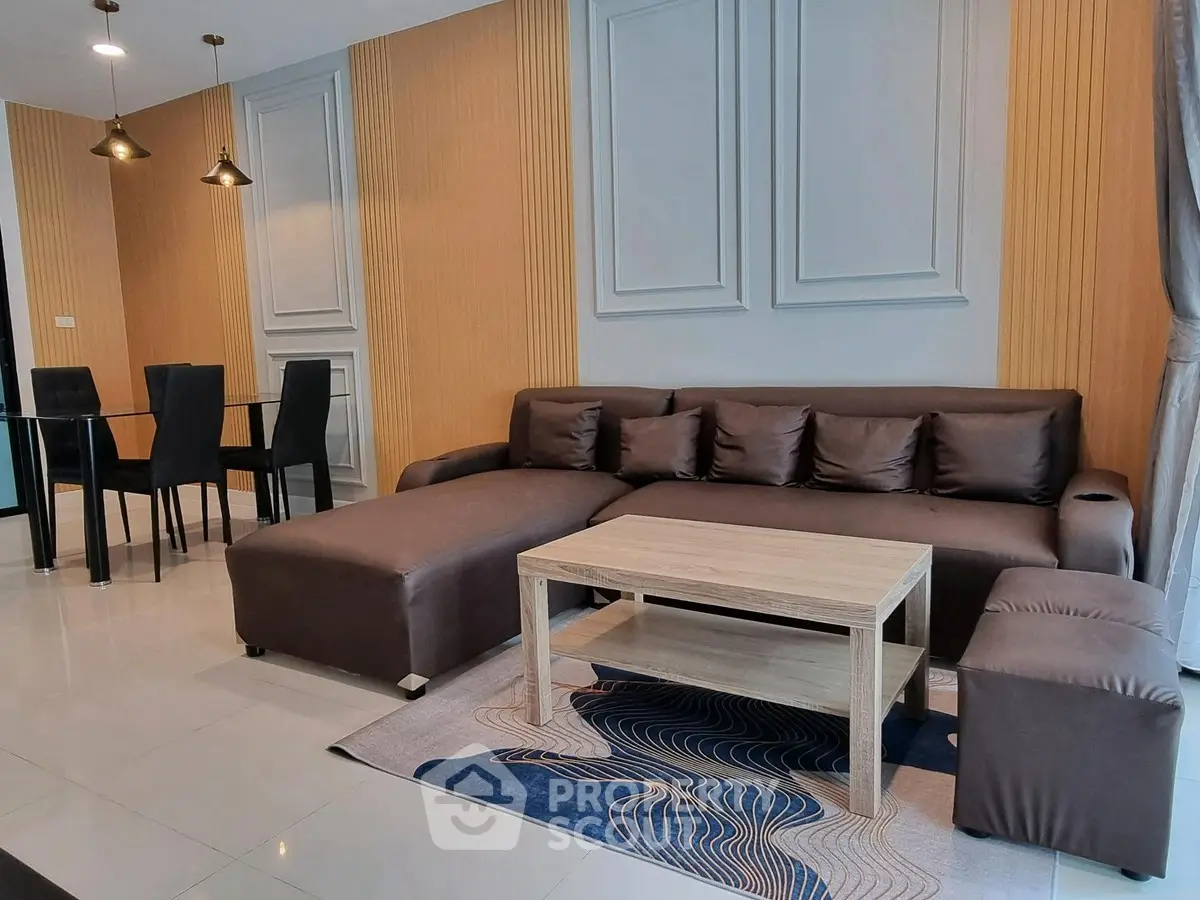 Modern living room with stylish brown sofa and elegant dining area