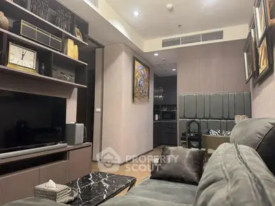 Modern living room with stylish decor and open view to kitchen area