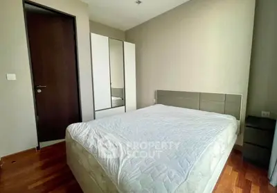 Spacious bedroom with modern design and wooden flooring