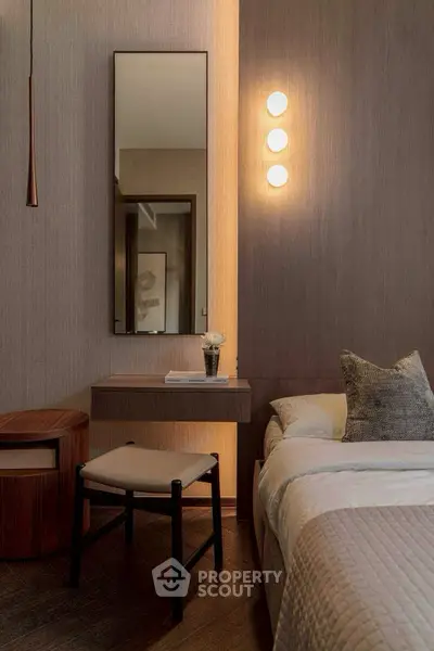 Elegant bedroom with modern lighting and stylish decor