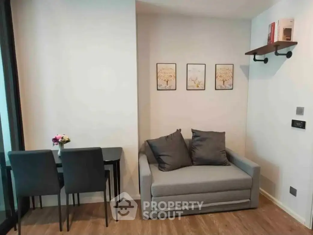 Cozy living room with modern decor and compact dining area, perfect for urban living.