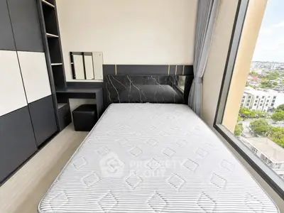 Modern bedroom with large window offering city view, sleek black and white furniture, and comfortable bed.