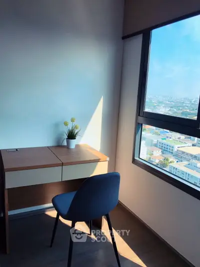 Bright study room with city view, featuring a modern desk and chair, perfect for productivity.