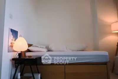 Cozy bedroom with modern lighting and minimalist decor