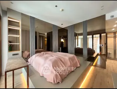 Luxurious modern bedroom with mirrored walls and ambient lighting