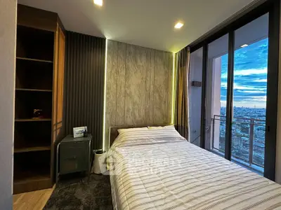 Modern bedroom with stunning city view and floor-to-ceiling windows