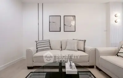 Modern living room with stylish decor and comfortable seating in a contemporary apartment.