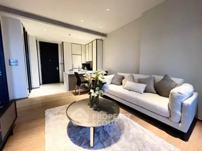 Modern living room with elegant decor and open kitchen layout