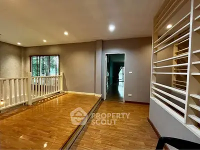 Spacious interior with wooden flooring and modern design, perfect for stylish living.