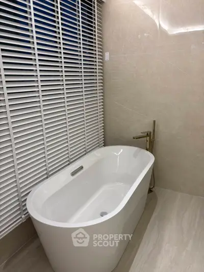 Luxurious bathroom with elegant freestanding bathtub and modern fixtures