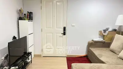 Cozy living room with modern decor and comfortable seating in a stylish apartment.