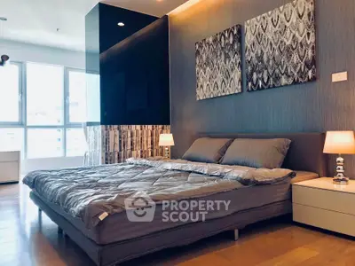 Luxurious modern bedroom with stylish decor and ample natural light