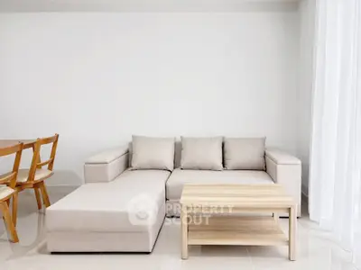 Modern living room with beige sectional sofa and wooden coffee table in bright minimalist design.