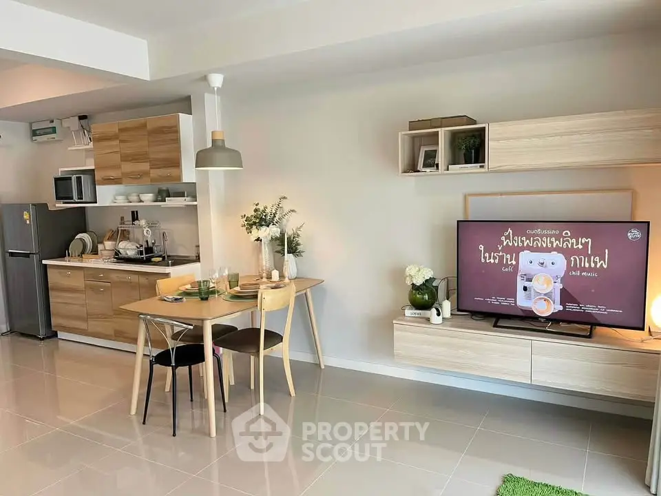 Modern open-plan living room with kitchen, dining area, and stylish decor