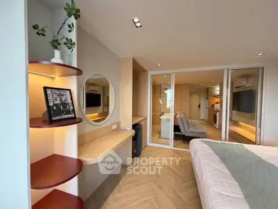 Modern bedroom with stylish decor and open layout in a contemporary apartment.