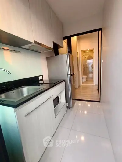 Modern kitchen with sleek design and glossy finishes