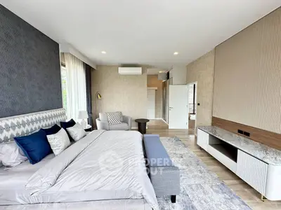Luxurious modern bedroom with elegant decor and ample natural light
