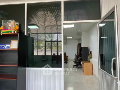 Spacious office interior with modern furniture and large windows