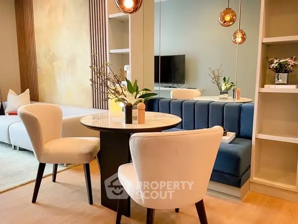 Elegant living room with modern dining area and stylish decor