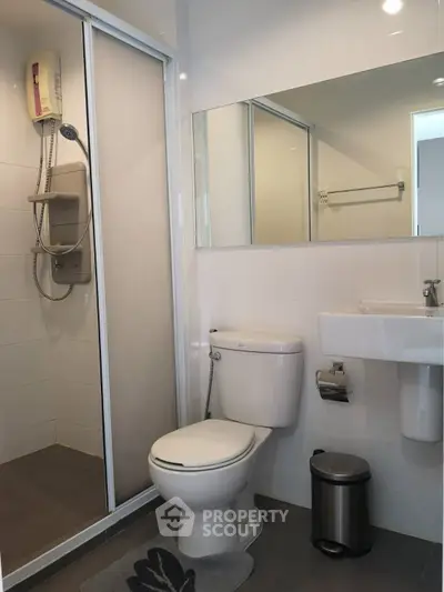 Modern bathroom with shower enclosure and sleek fixtures