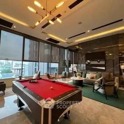 Luxurious modern living room with pool table and city view, perfect for entertainment and relaxation.