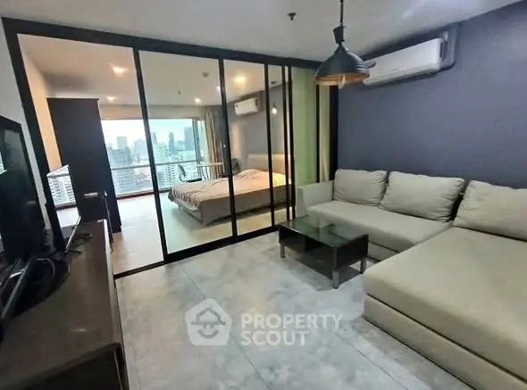 Modern living room with glass partition and city view