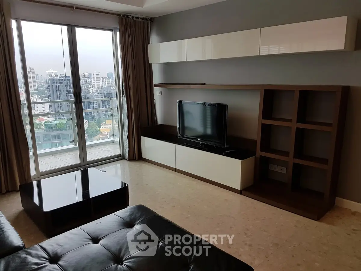 Modern living room with city view, sleek furniture, and large windows.