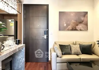 Modern living room with elegant decor and open kitchen layout