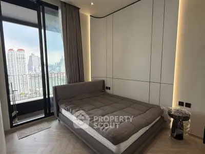 Modern bedroom with city view and balcony access in luxury apartment