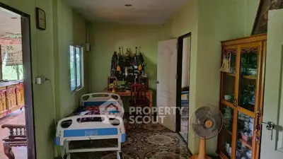 Cozy room with hospital bed and traditional decor, ideal for home care setup.