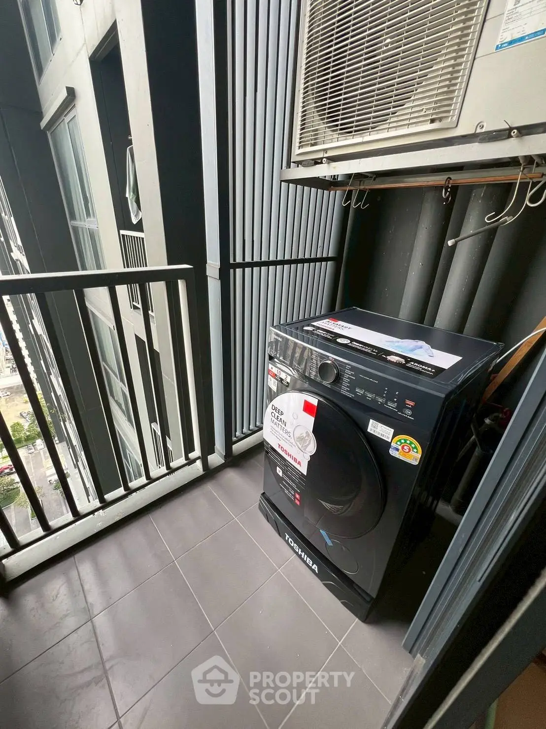 Compact balcony with washing machine and air conditioning unit