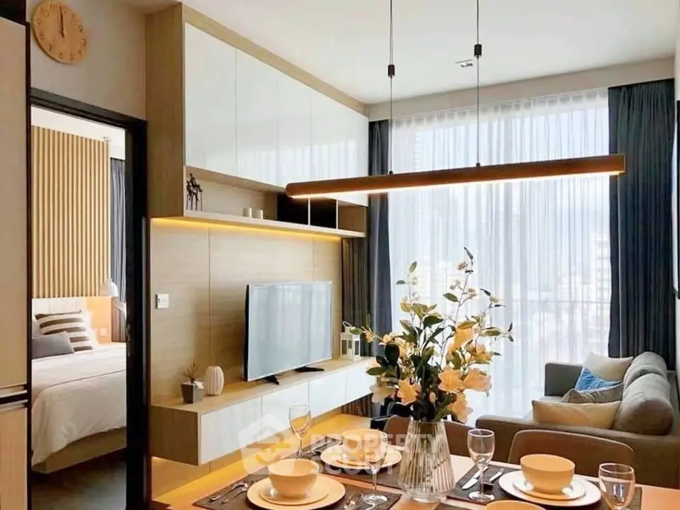 Modern living room with elegant dining area and stylish decor in a contemporary apartment.
