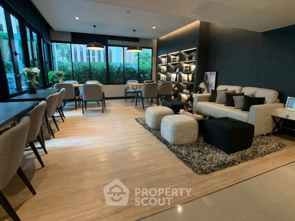 Stylish modern living room with elegant decor and ample natural light.