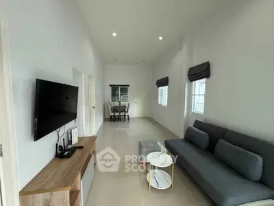 Spacious modern living room with sleek furniture and natural light