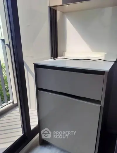 Modern storage unit near large window with natural light