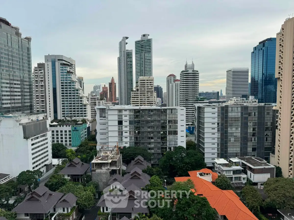 Stunning cityscape view showcasing modern high-rise buildings and lush greenery in a vibrant urban setting.