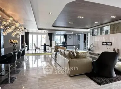 Luxurious open-plan living room with modern decor and elegant lighting