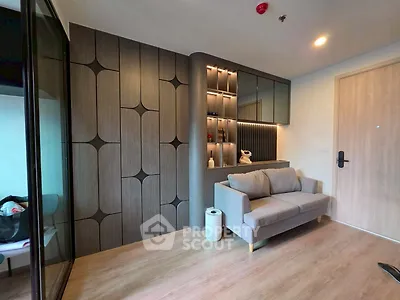 Modern living room with stylish wood paneling and cozy sofa